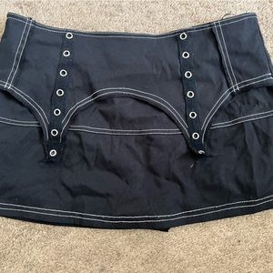 A minimalist black mini skirt with safety shorts